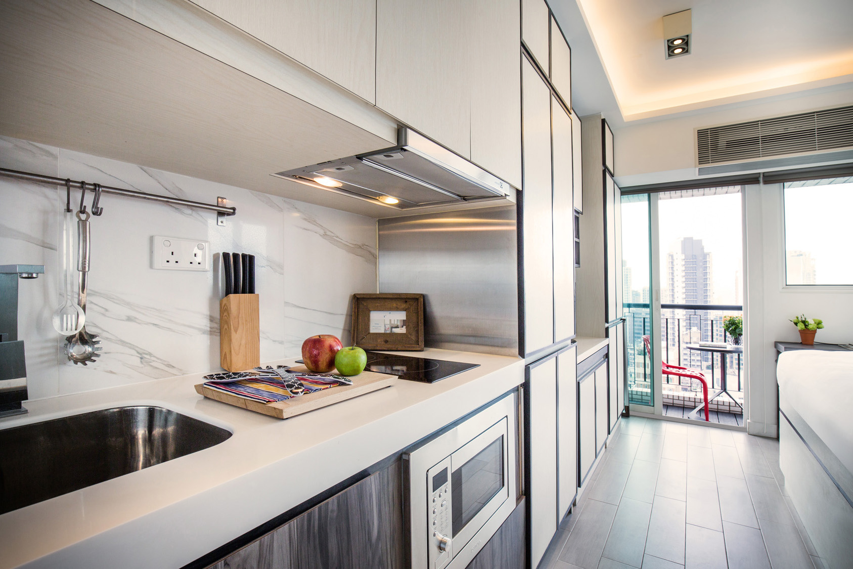 Studio kitchen with countertop space at The Lodge by V serviced apartment in West Kowloon